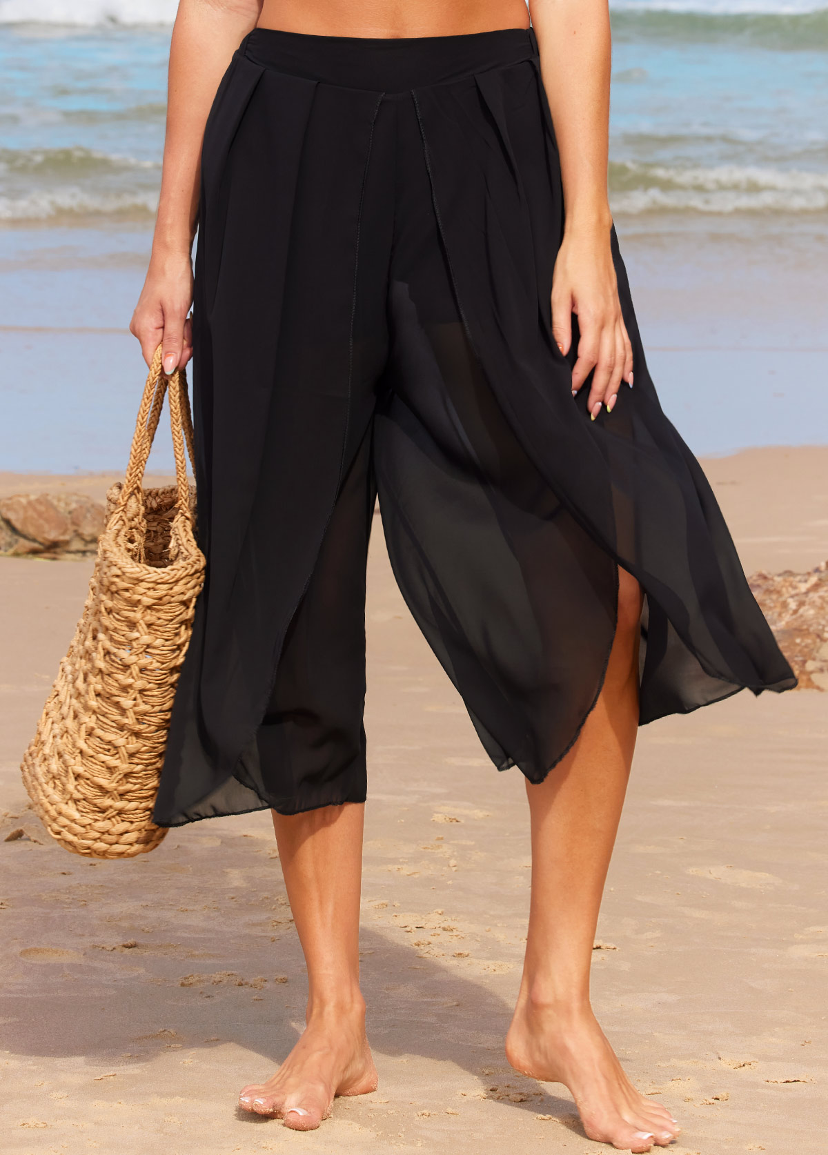 Schwarze Strandhose mit hohem Bund und seitlichem Schlitz