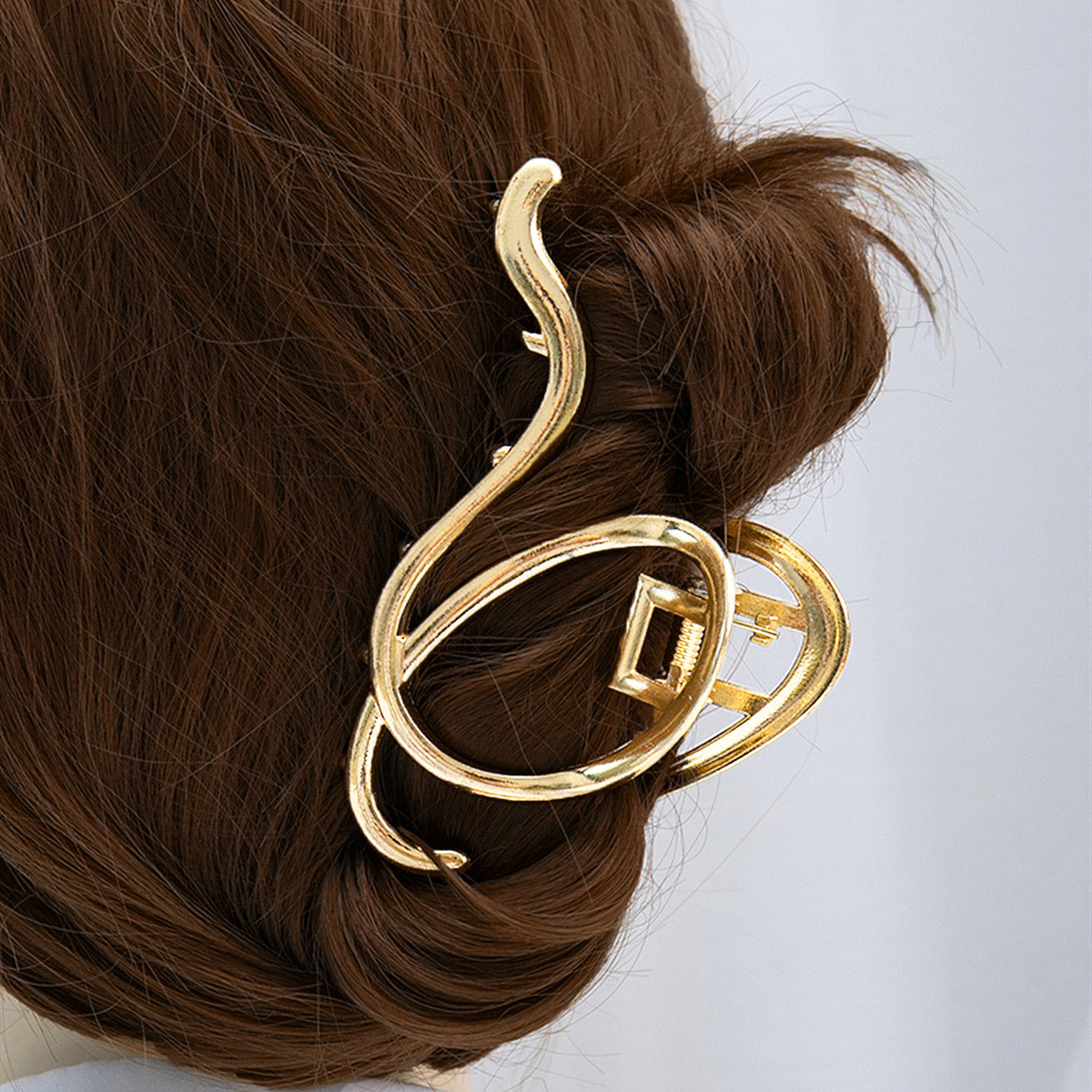 Barrette asymétrique en métal avec motif doré