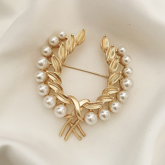 Broche en forme de perle avec détail feuille d'or