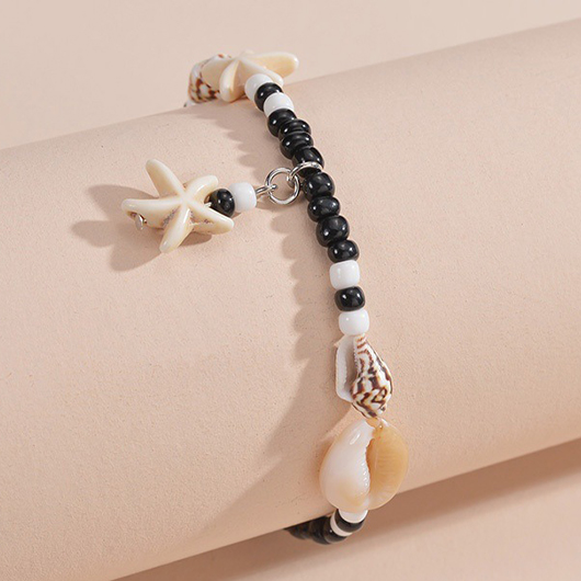 Schwarzes Fußkettchen aus Polyresin mit Muscheldetails und Perlen