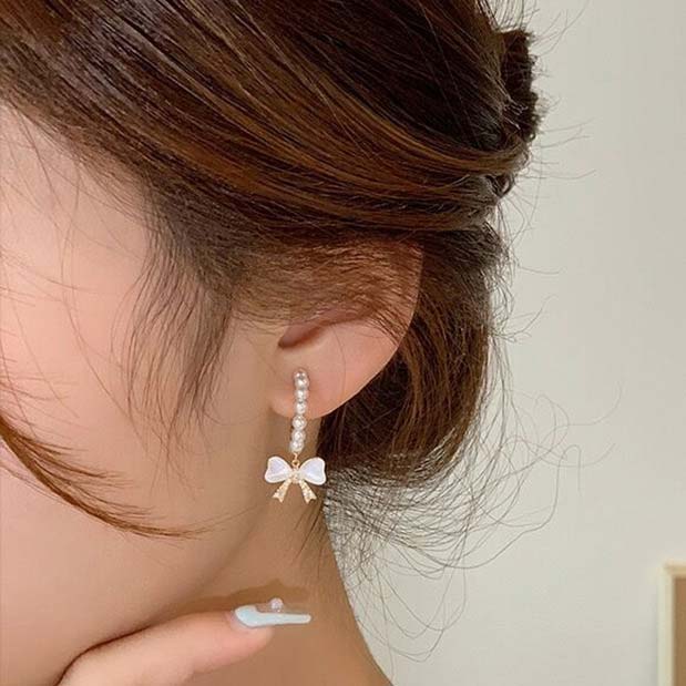 Golden Alloy Pearl Bowknot Design Earrings