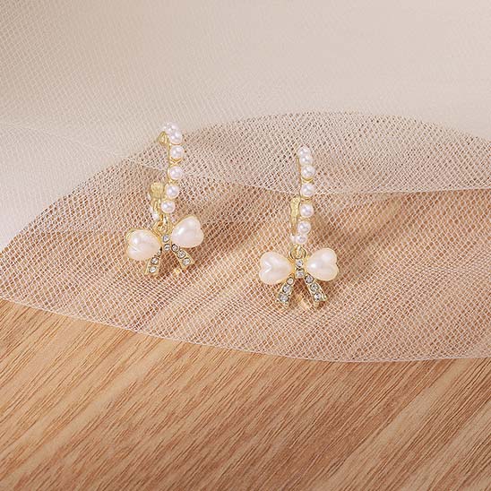Golden Alloy Pearl Bowknot Design Earrings
