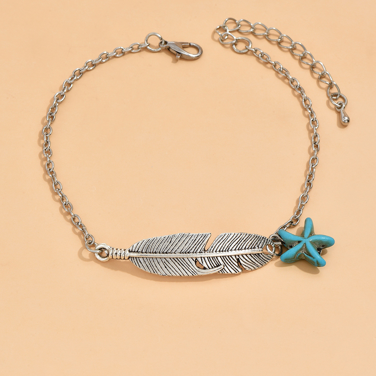 Bracelet de cheville en alliage d'argent avec motif d'étoile de mer et de plumes