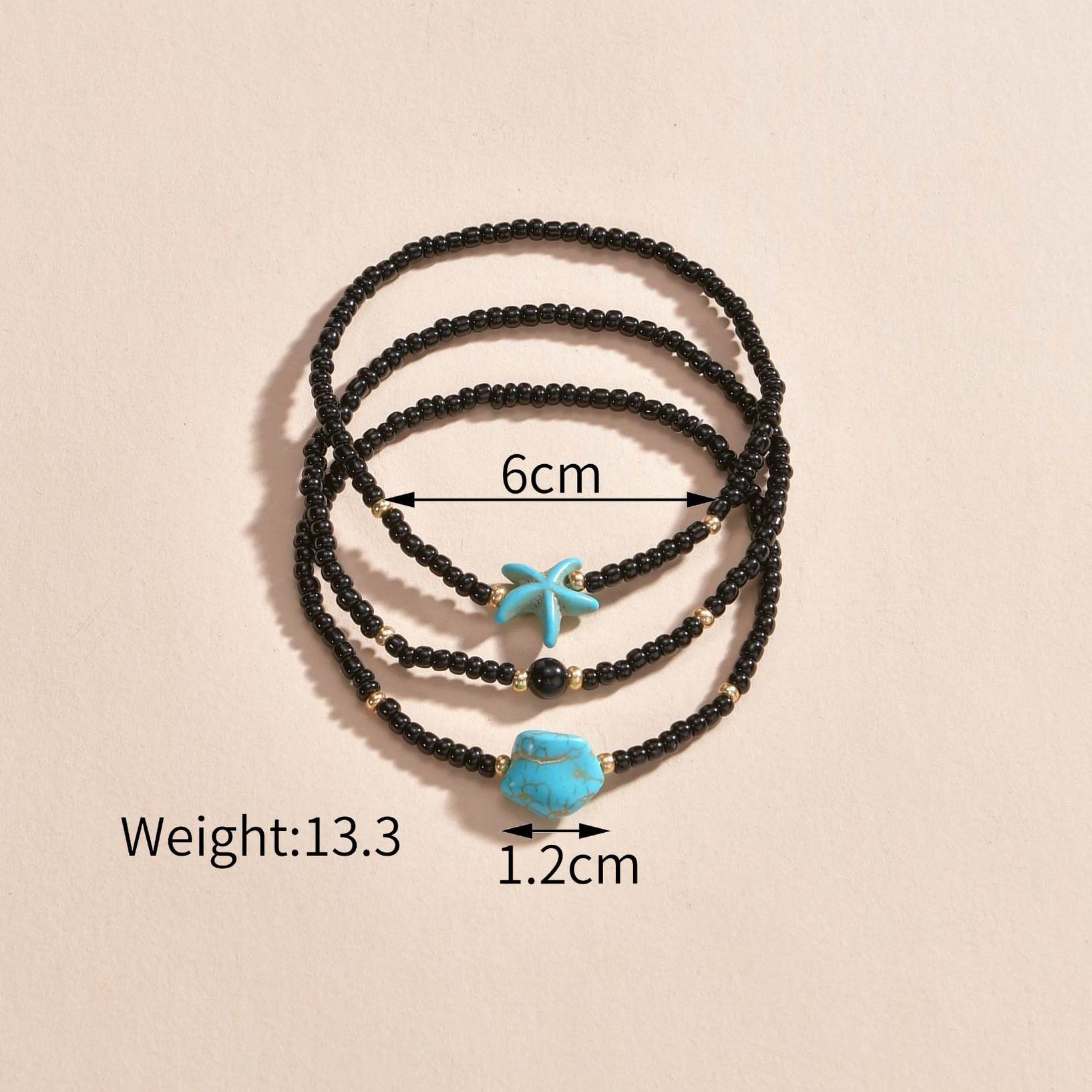 ensemble de bracelets de cheville en perles de polyrésine noire en forme d'étoile de mer