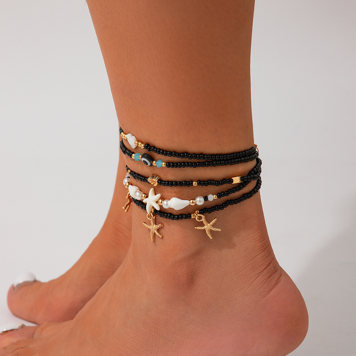 Bracelet de cheville à breloques de plage de couleur noire