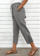 pantalon gris clair à taille élastique et jambe droite avec cordon de serrage