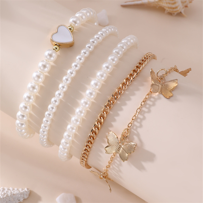 bracelets de cheville en polyrésine de couleur dorée avec des détails papillon