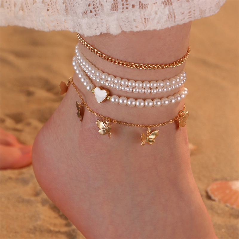 bracelets de cheville en polyrésine de couleur dorée avec des détails papillon