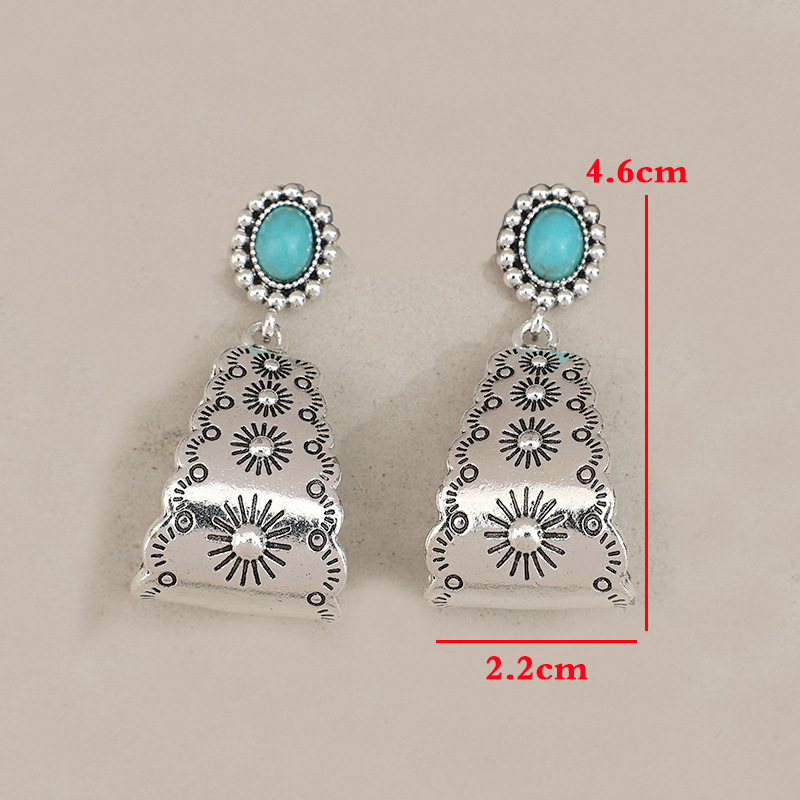 boucles d'oreilles géométriques couleur argent avec détails en alliage