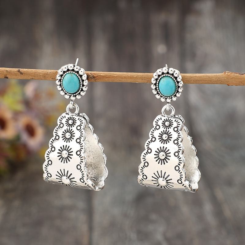 boucles d'oreilles géométriques couleur argent avec détails en alliage