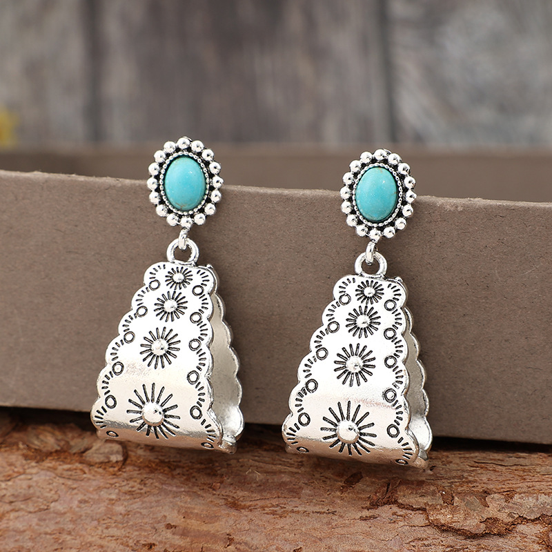 boucles d'oreilles géométriques couleur argent avec détails en alliage