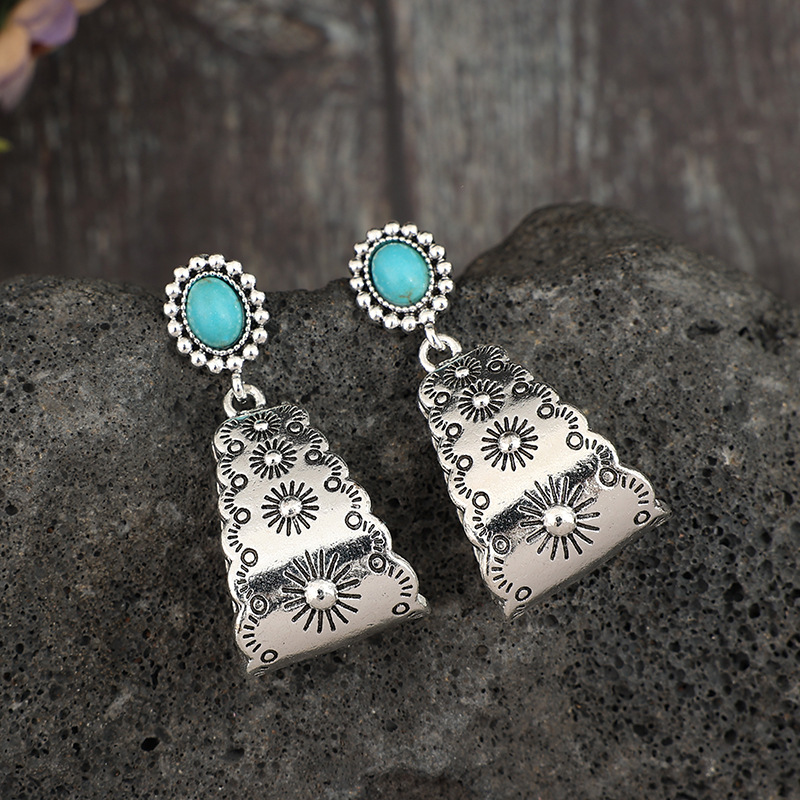 boucles d'oreilles géométriques couleur argent avec détails en alliage