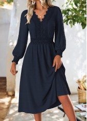 Robe Rotita bleu marine à manches longues et col en V couvrant le ventre
