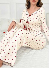 haut de détente à manches longues et pantalon beige à imprimé coeur