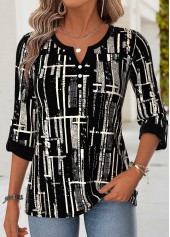 schwarze Bluse mit geschwungenem Saum geometrischem Muster und V-Ausschnitt