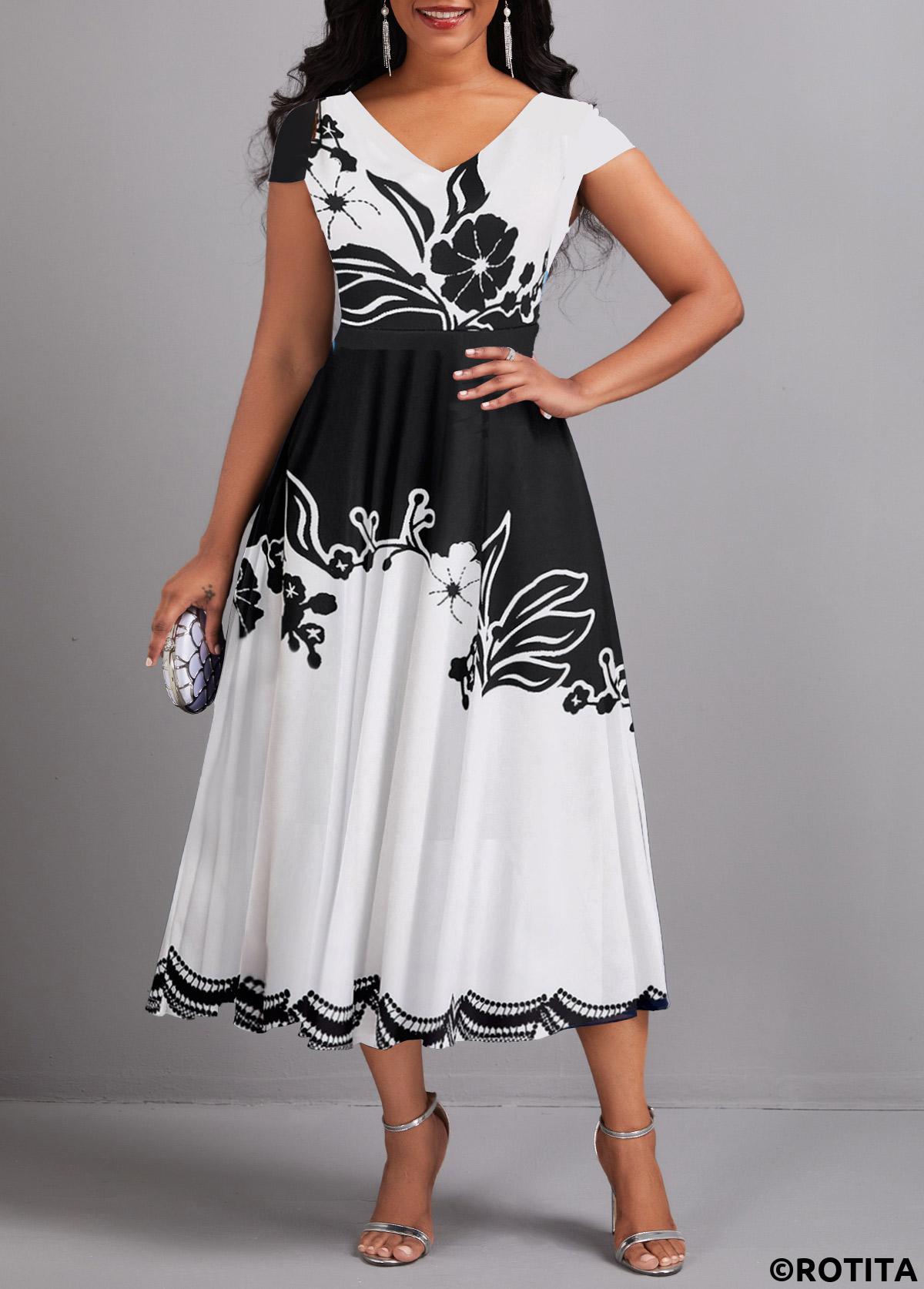 Rotita-Kleid mit Regenschirmsaum und Blumendruck in Schwarz mit V-Ausschnitt
