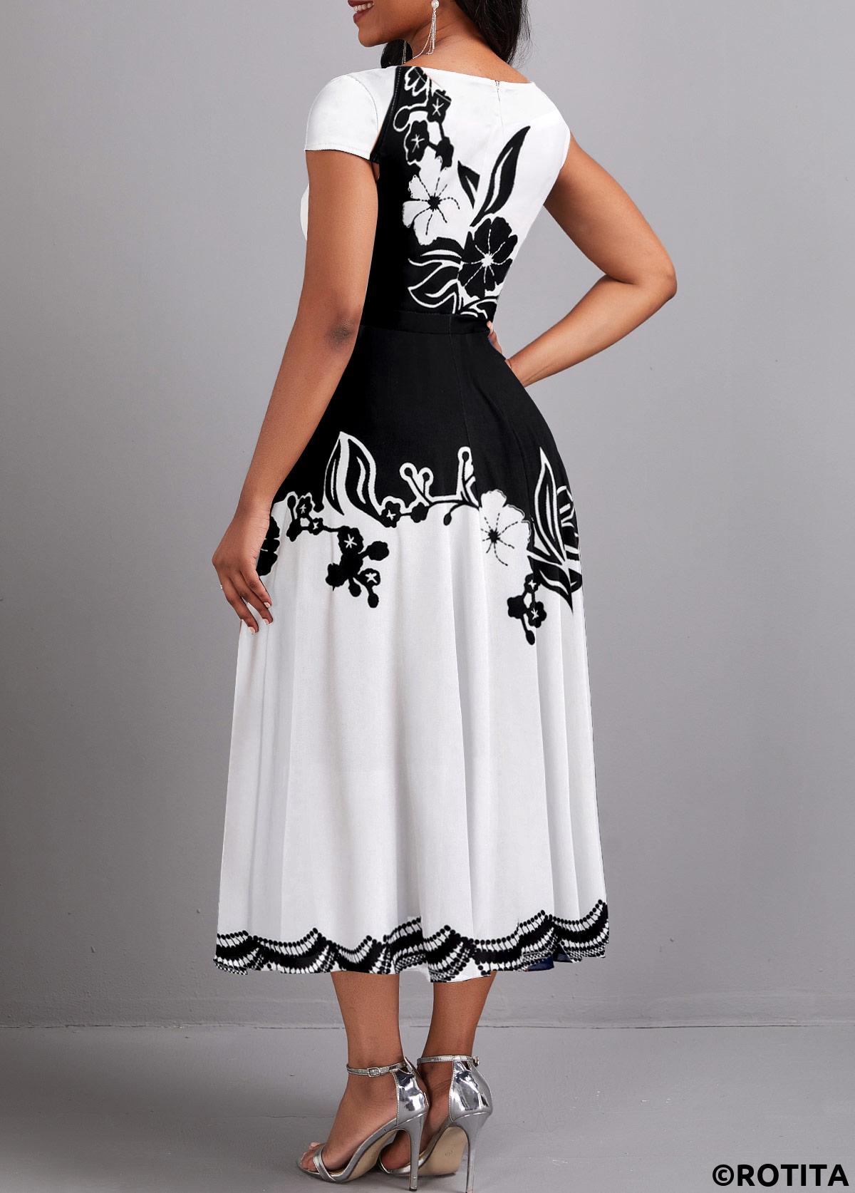 Rotita-Kleid mit Regenschirmsaum und Blumendruck in Schwarz mit V-Ausschnitt