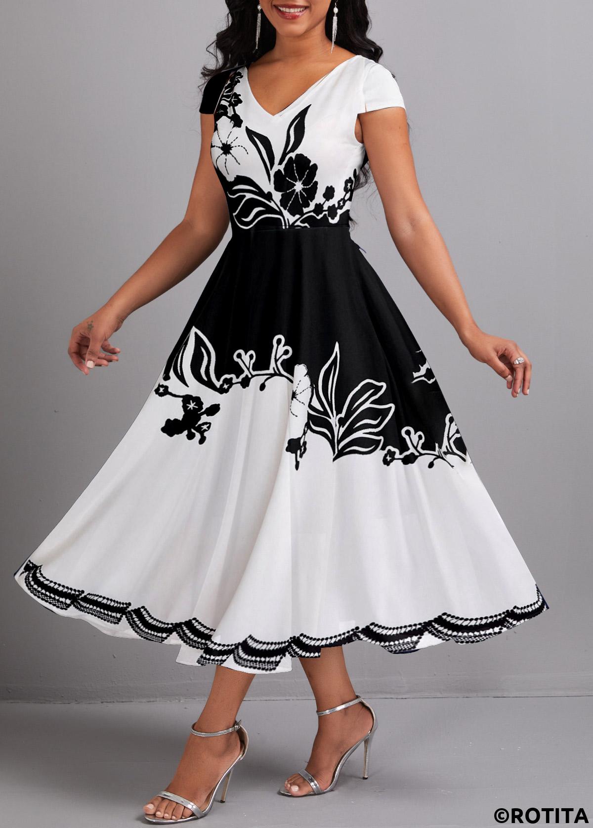 Rotita-Kleid mit Regenschirmsaum und Blumendruck in Schwarz mit V-Ausschnitt