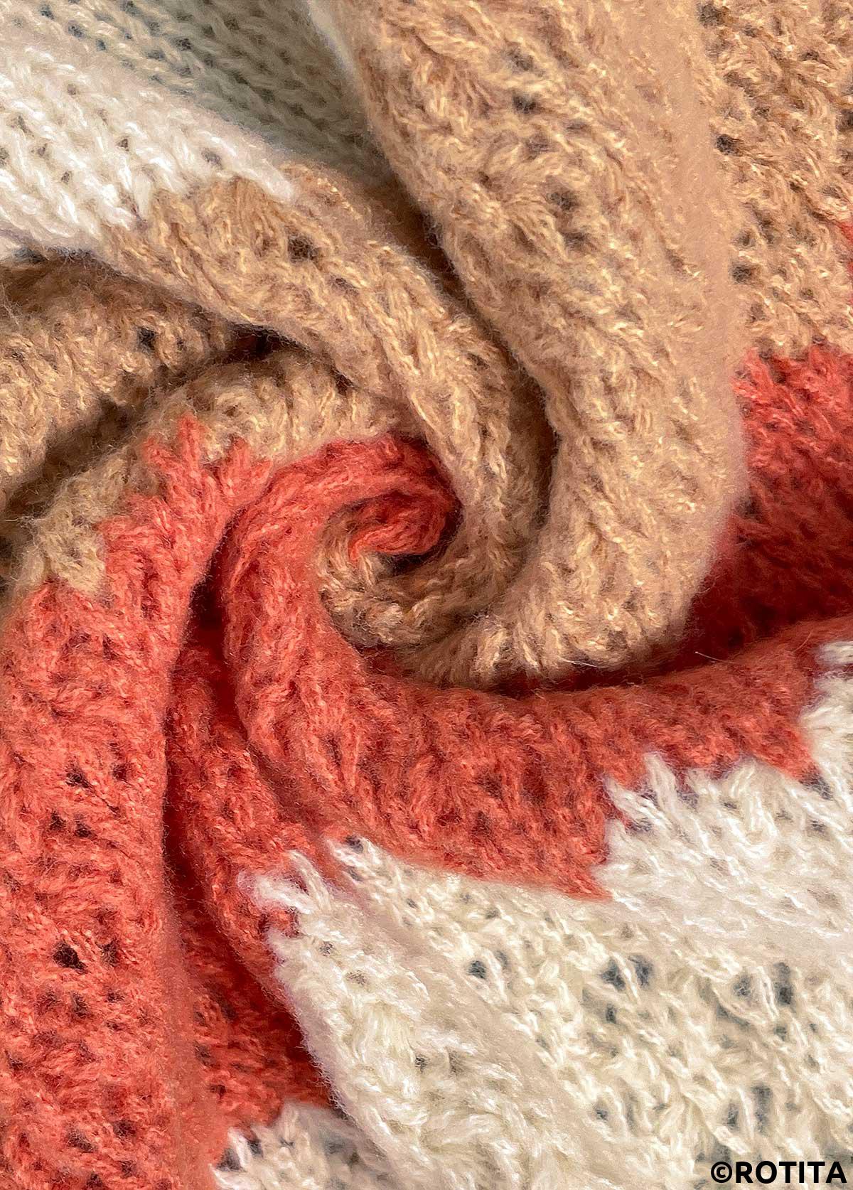 orangefarbene Strickjacke mit langen Ärmeln im Patchwork-Design